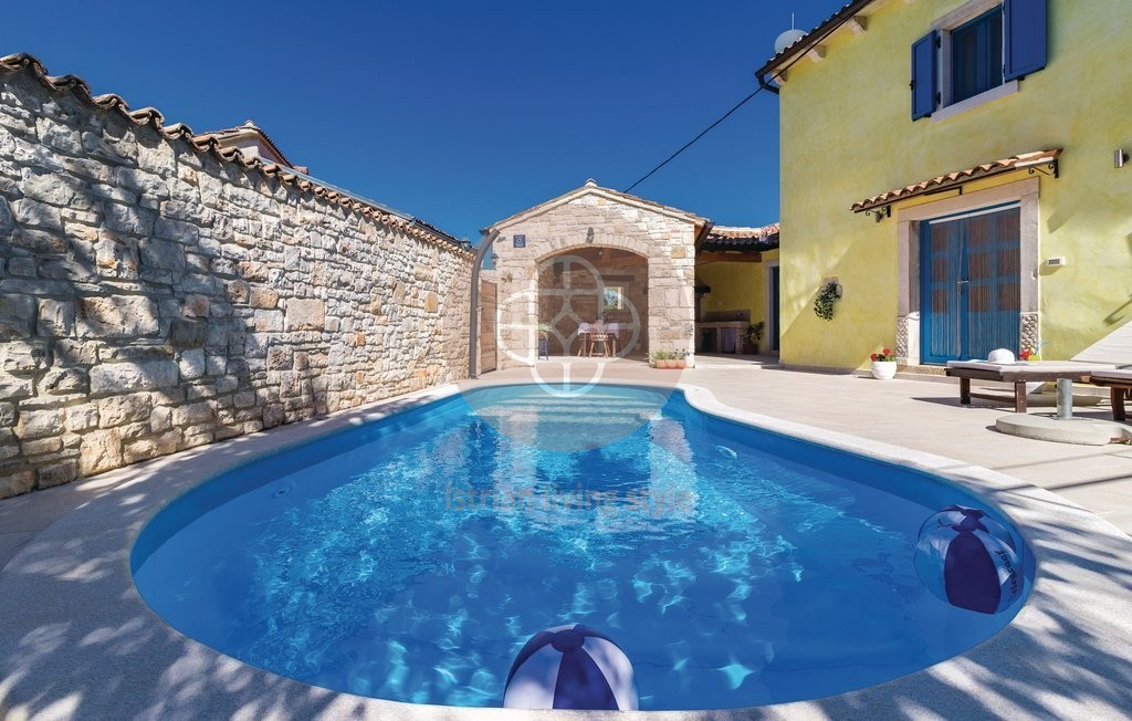 Photo of A beautiful Istrian stone house with a swimming pool on the edge of the village, near Barban