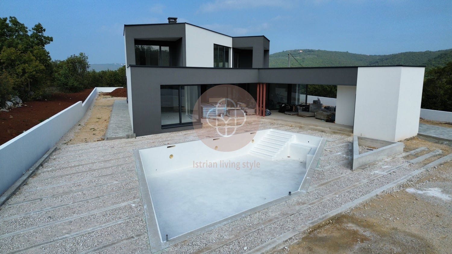 Photo of Modern villa in the final stage of construction with a large swimming pool