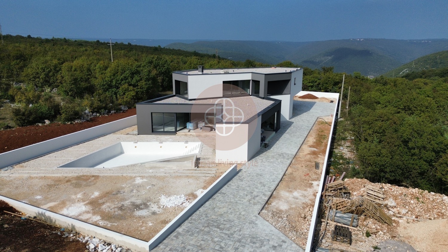 Photo of Modern villa in the final stage of construction with a large swimming pool