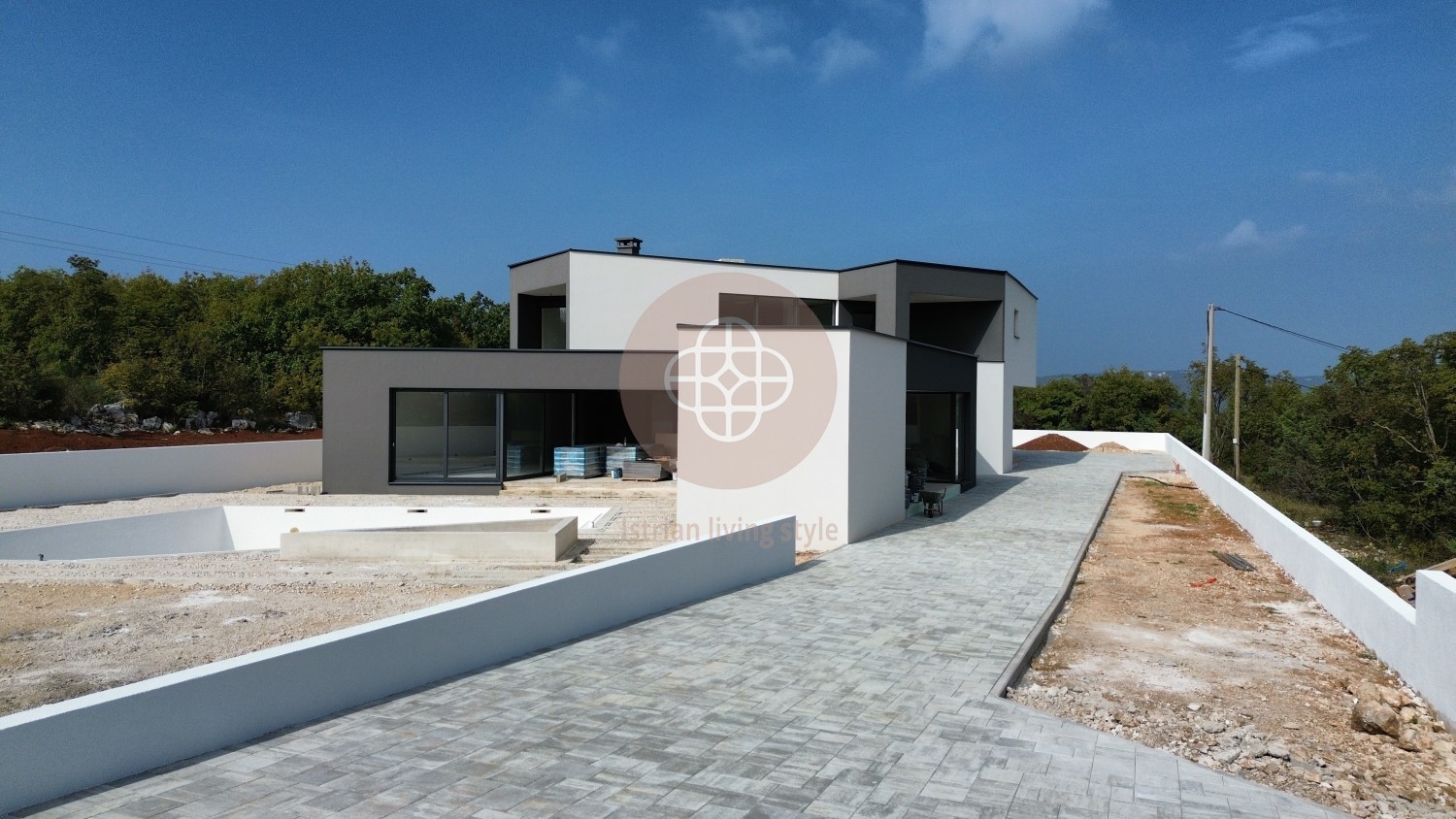 Photo of Modern villa in the final stage of construction with a large swimming pool