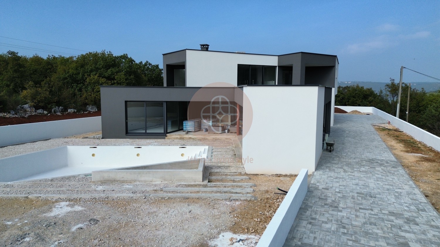 Photo of Modern villa in the final stage of construction with a large swimming pool