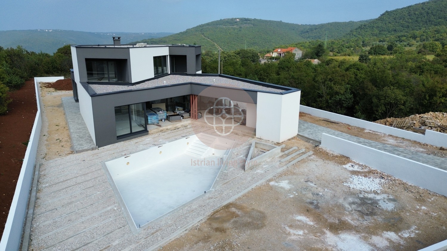 Photo of Modern villa in the final stage of construction with a large swimming pool