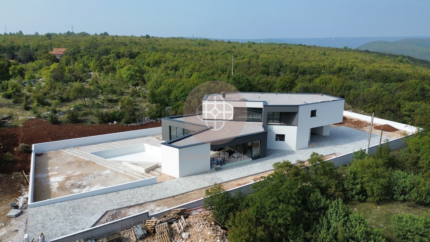 Photo of Modern villa in the final stage of construction with a large swimming pool