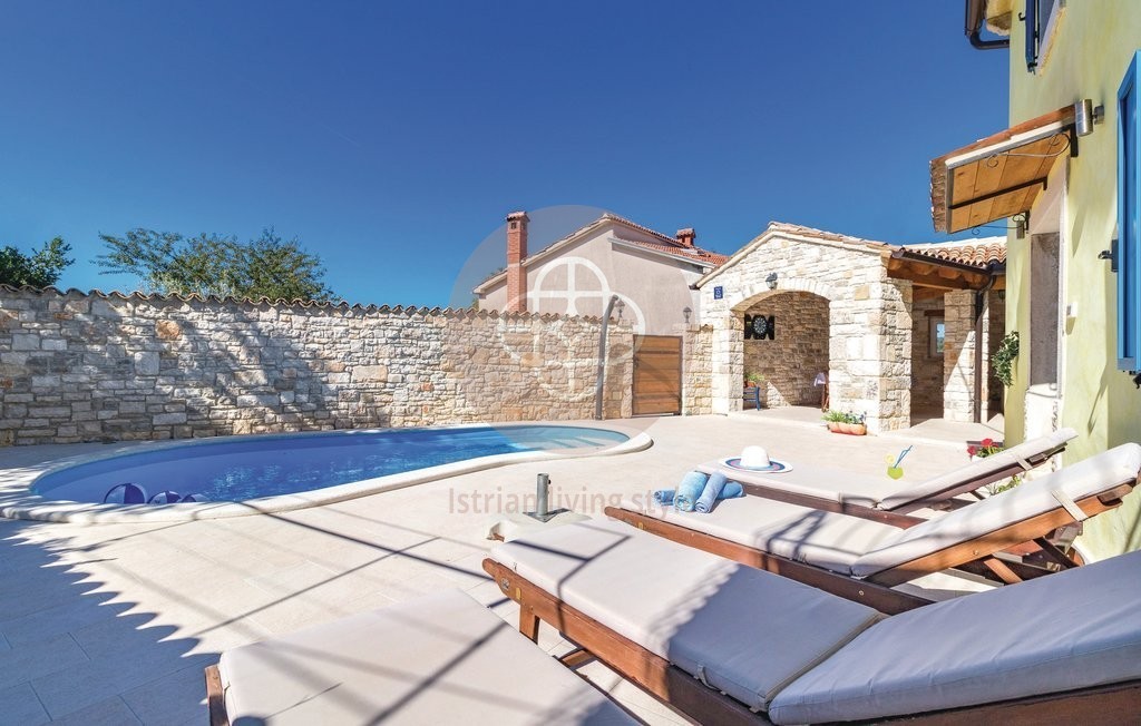 Photo of A beautiful Istrian stone house with a swimming pool on the edge of the village, near Barban